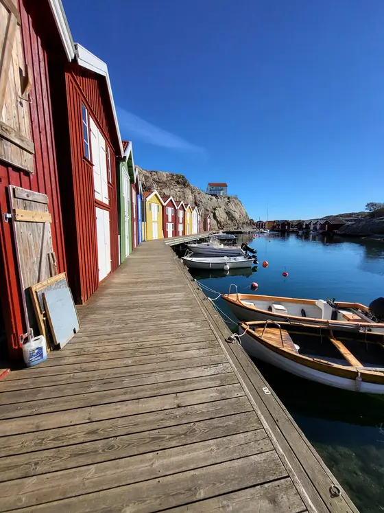 Red boathouses, a jetty, and nowhere else to be