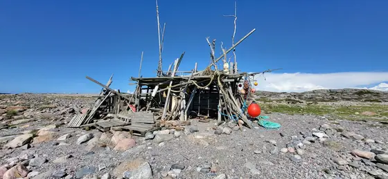A driftwood shelter built by strangers and improved by us