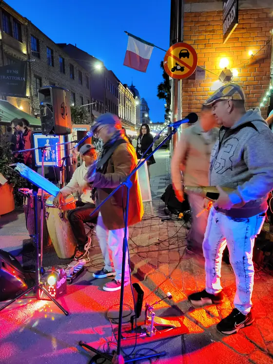A band in a small room, which is the best way to hear one